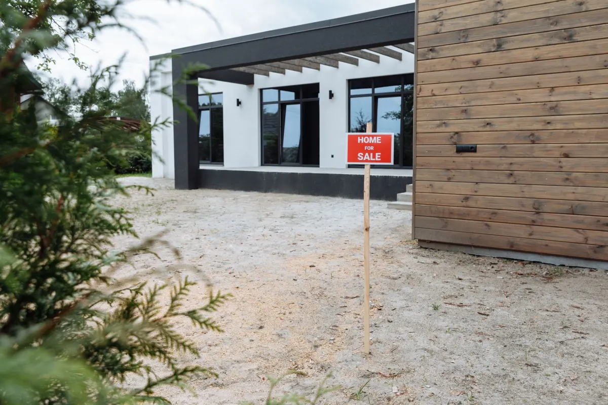 An open house yard sign in front of a home, the kind of listing content that anchors a brokerage's weekly social posting schedule.