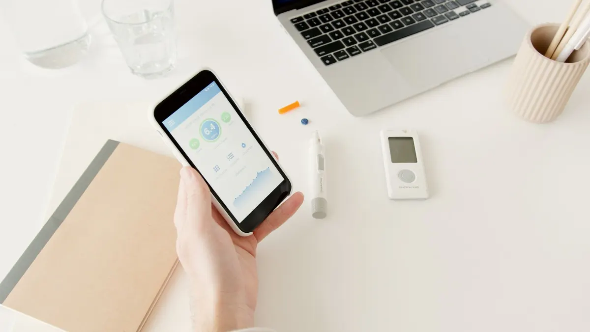 A person scrolling through a social app on their phone, illustrating the kinds of engagement figures a post's likes and reposts actually show.