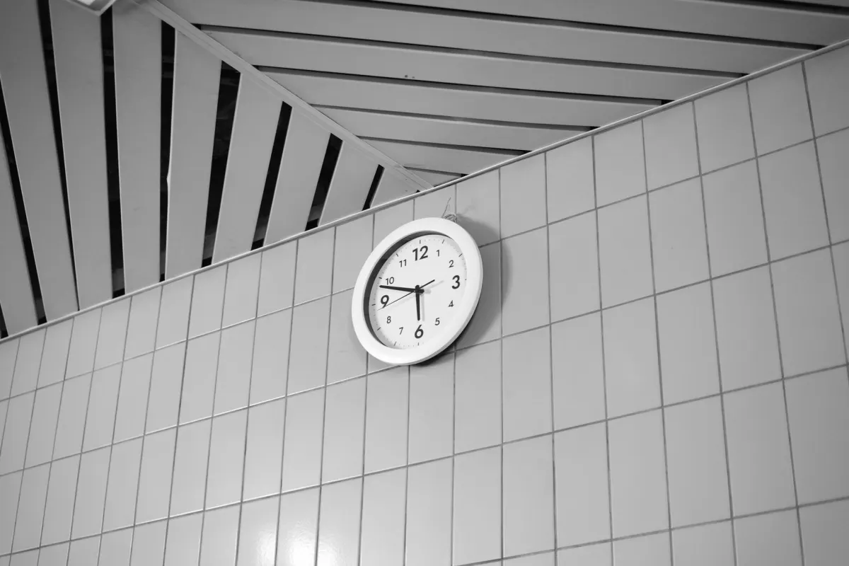 A wall clock in an office marks the passage of time, standing in for waiting out a rate limit before retrying.