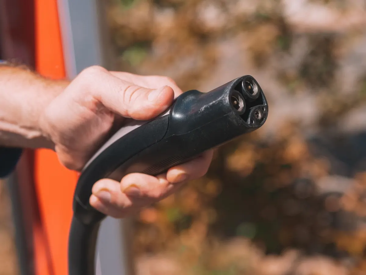 A hand pulling a power cable out of a socket, standing in for cutting an agent's access at once.