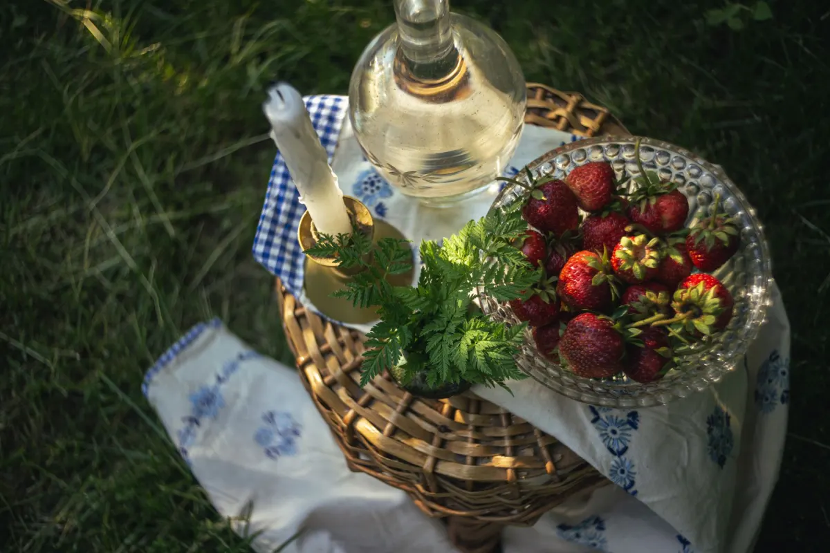 A flat lay of a linen tablecloth with brass candlesticks, the kind of image whose subject good alt text should name first.