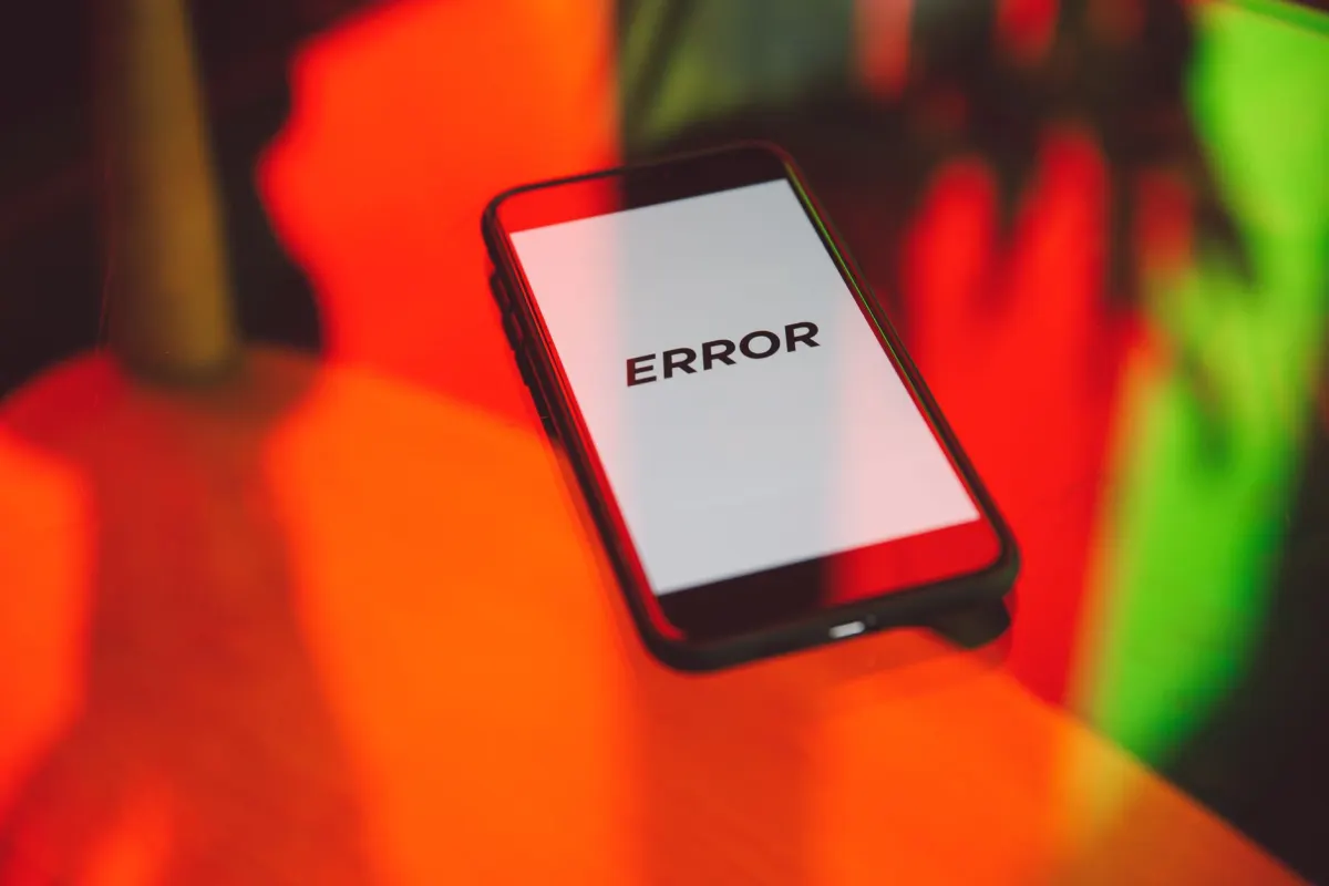 A close-up of an error message on a phone screen represents the 429 response an app receives when it exceeds Pinterest's rate limit.