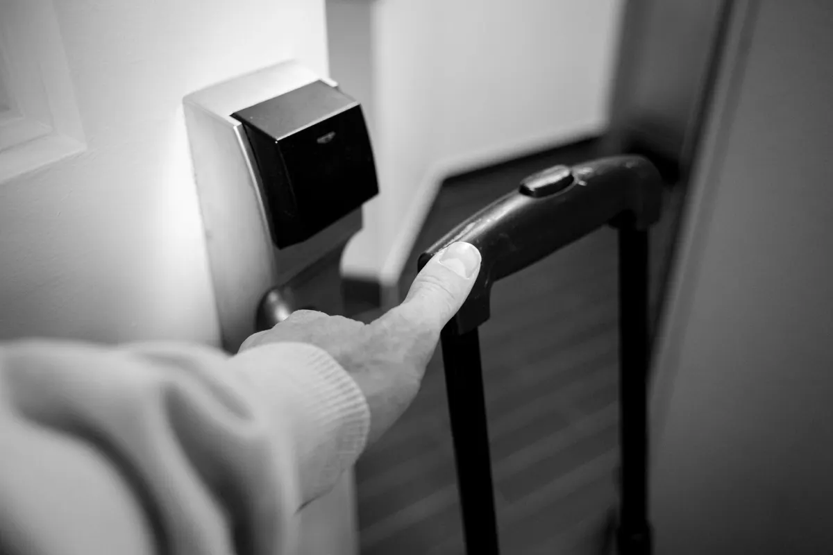A keycard being swiped at a locked door, illustrating the least-privilege approach to granting bot permissions.