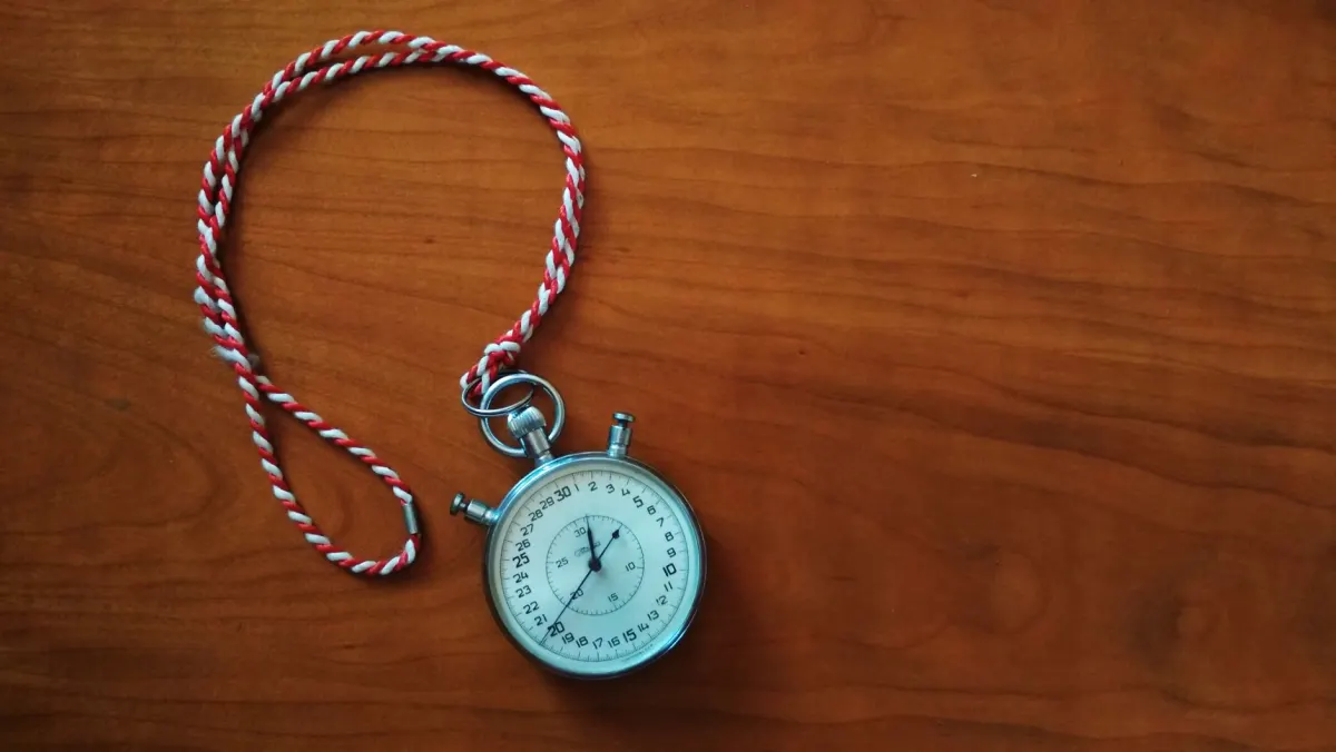 A close-up of a stopwatch, illustrating the FAQ question about the video duration values TikTok returns.
