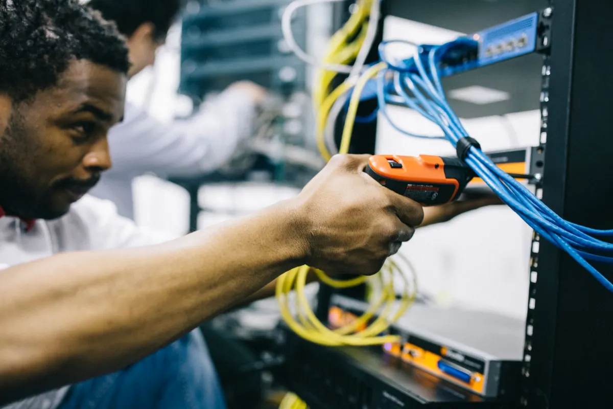 A technician inspecting a server rack, reflecting the uptime and security checks the healthcheck skill runs.