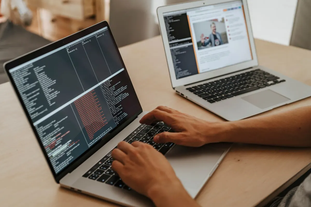 A developer working at a laptop, fitting this section on developer-friendly tools like Pirsch.