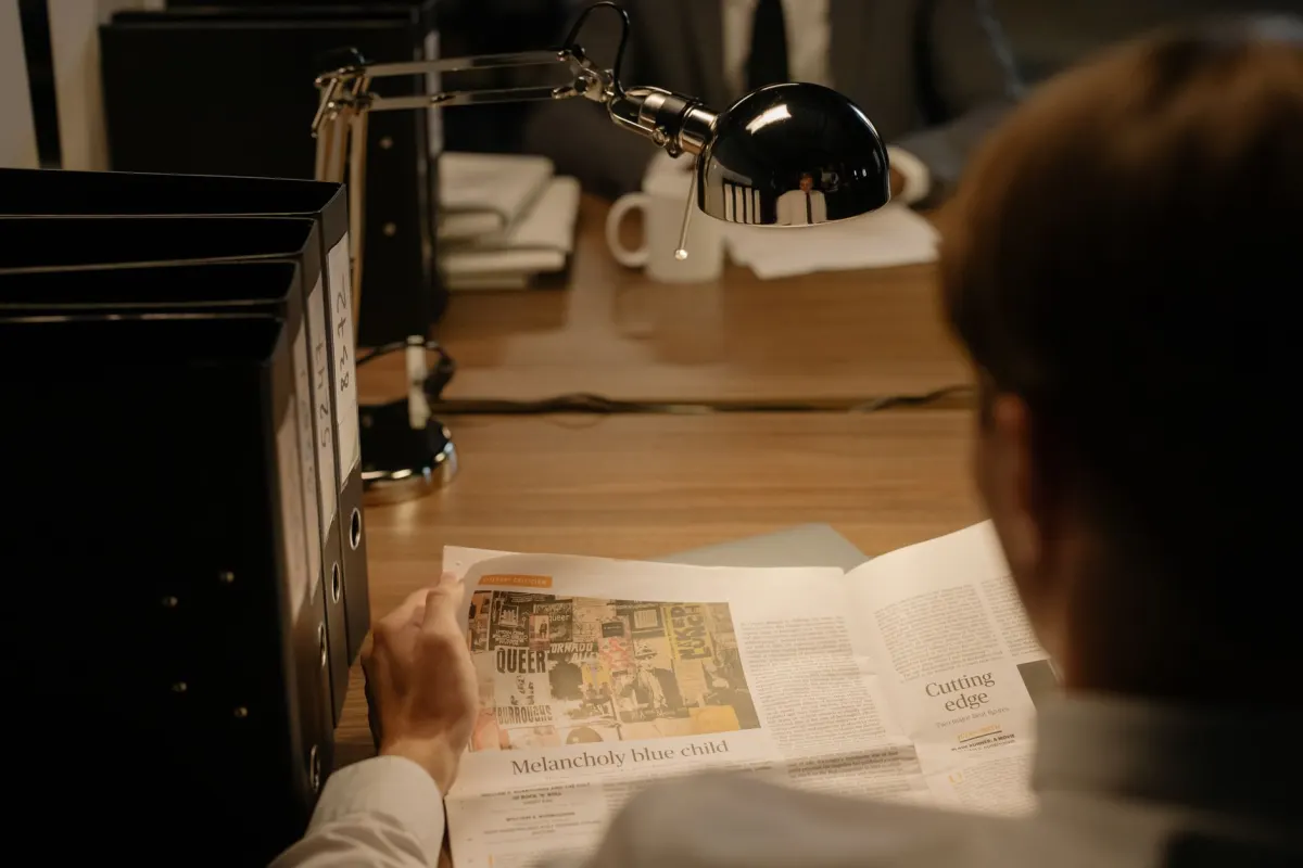 A person reviews paperwork at a desk, reflecting the privacy checks a team should run before installing any ecommerce tracker.