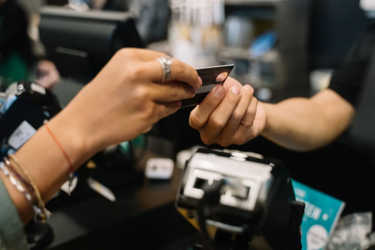 A shopper adds items to an online cart and pauses before entering payment details.