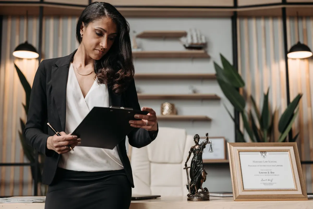 A person reviews a privacy policy document at a desk, reflecting the legal review needed before installing session replay.