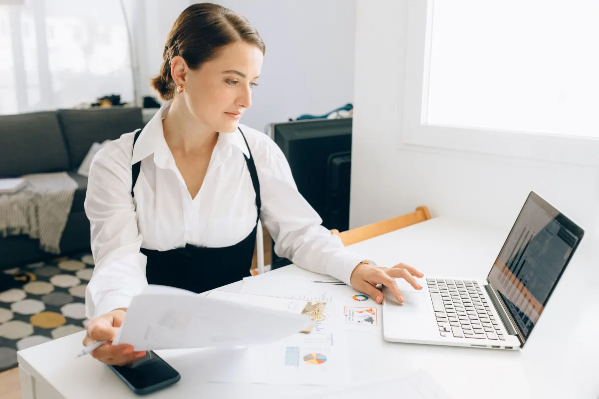 A founder reviewing a sales report on paper, reflecting the revenue-first approach tools like DataFast are built around.