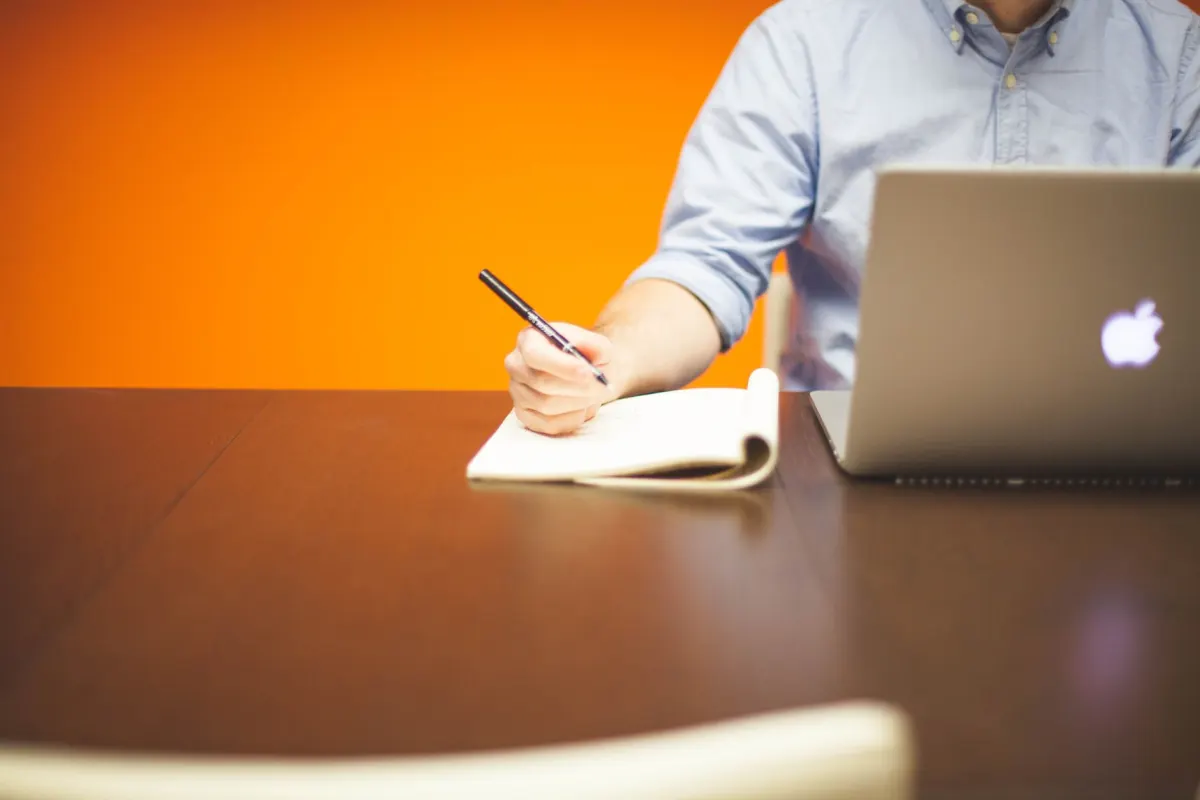 A solo founder works at a desk, the kind of maker-led setup that favors revenue-first analytics tools.