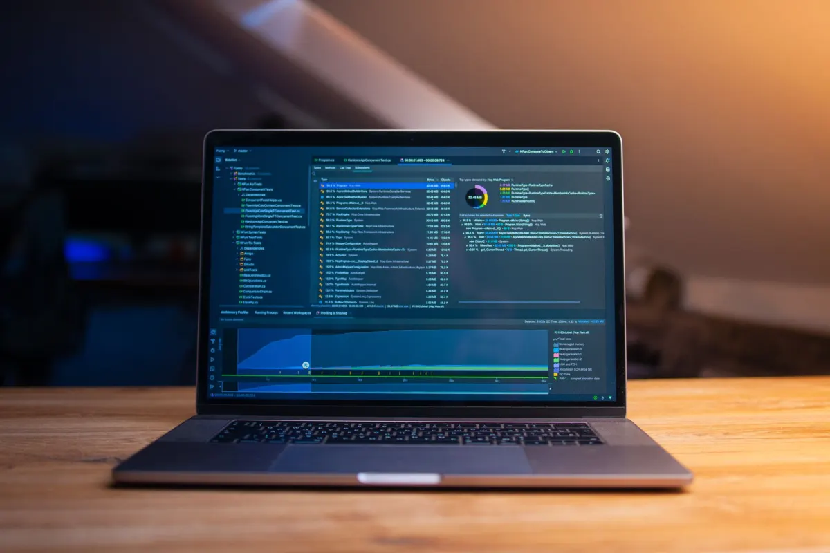 A developer working on a laptop, representing the app and SDK activity built on top of Bluesky's open protocol.