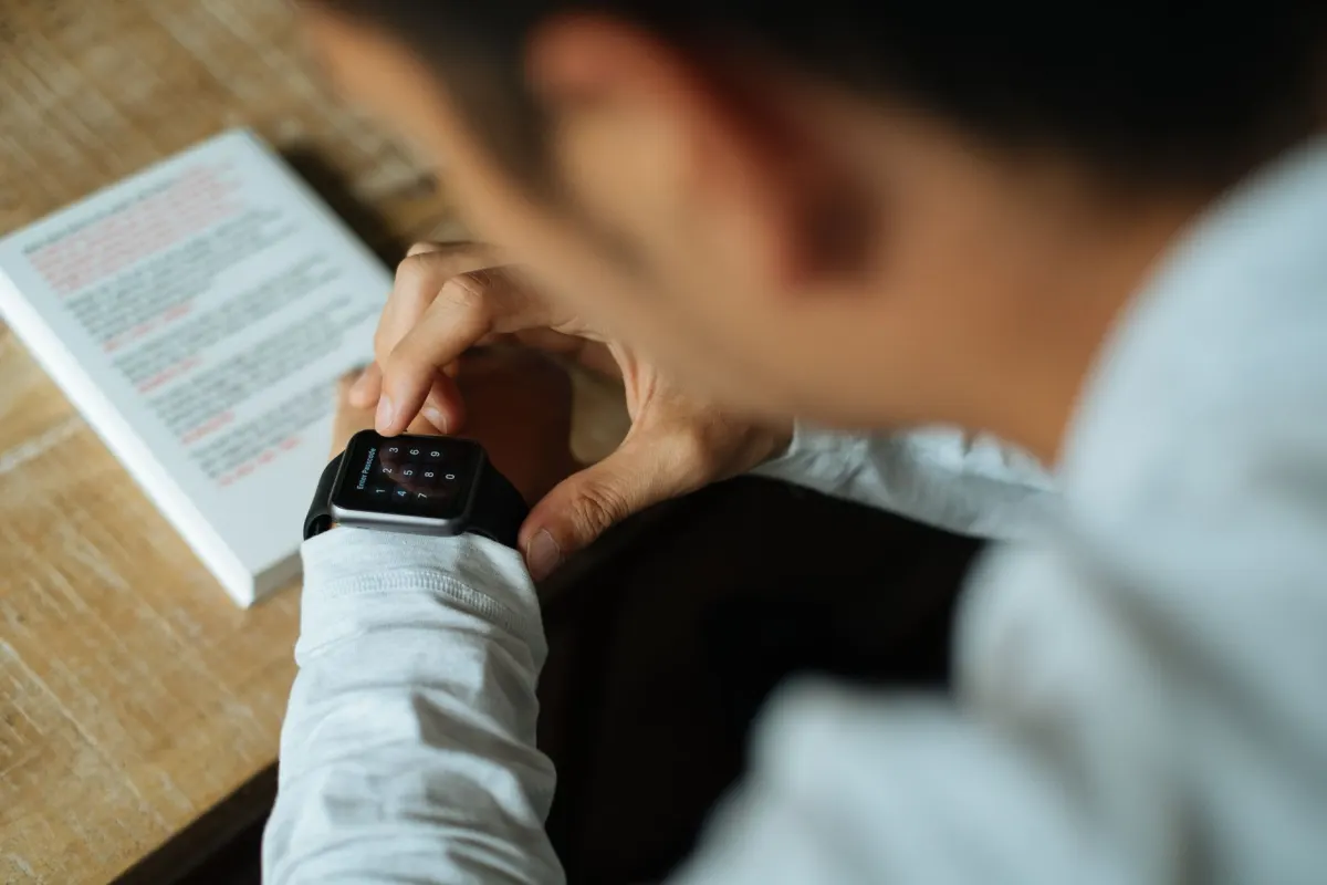 A person reads a new alert on a laptop at their desk, the kind of quick check that replaces sifting through an old export.