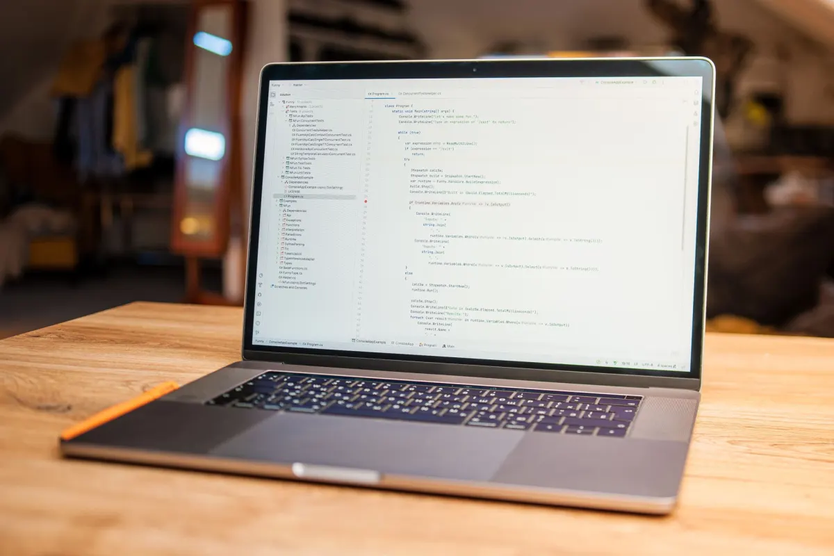 A laptop screen showing configuration code, representing the AutoModerator rules moderators write to gate posts.