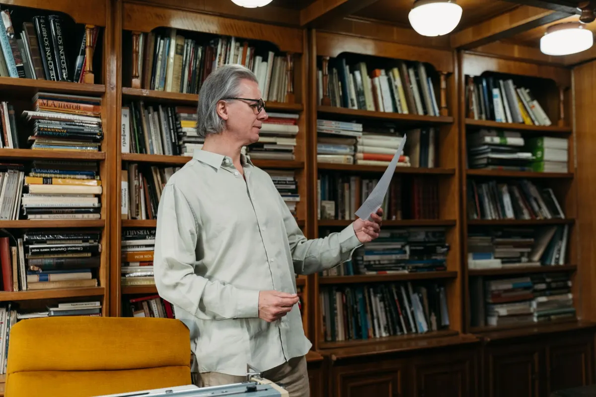 A researcher checks a printed report against its cited source, next to the section on why most social listening statistics are unreliable.