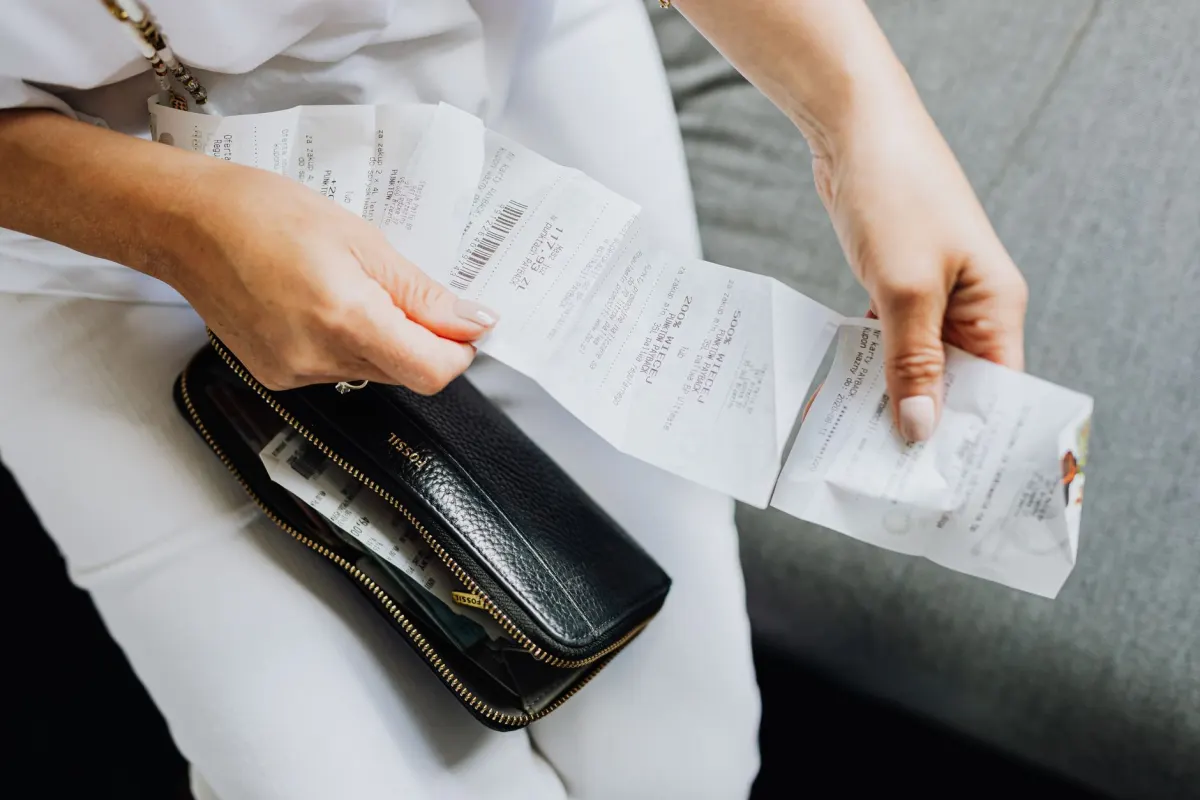 A person reviewing a billing statement, next to the section explaining how to calculate a monthly X API bill.
